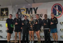 Army Ten Miler team on stage with award. U.S. Army logo visible.