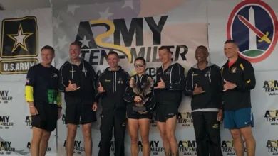 Army Ten Miler team on stage with award. U.S. Army logo visible.