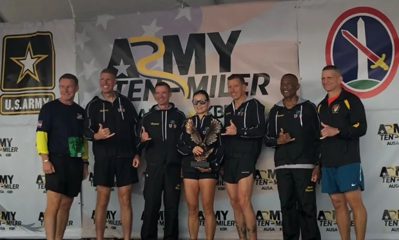 Army Ten Miler team on stage with award. U.S. Army logo visible.