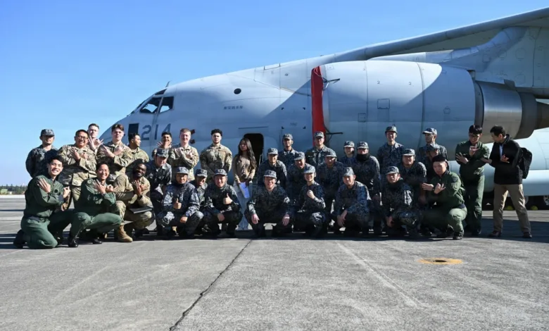 Group photo of US and Japanese service members in front of a C-130 at Yokota Air Base. Allied Partnership.