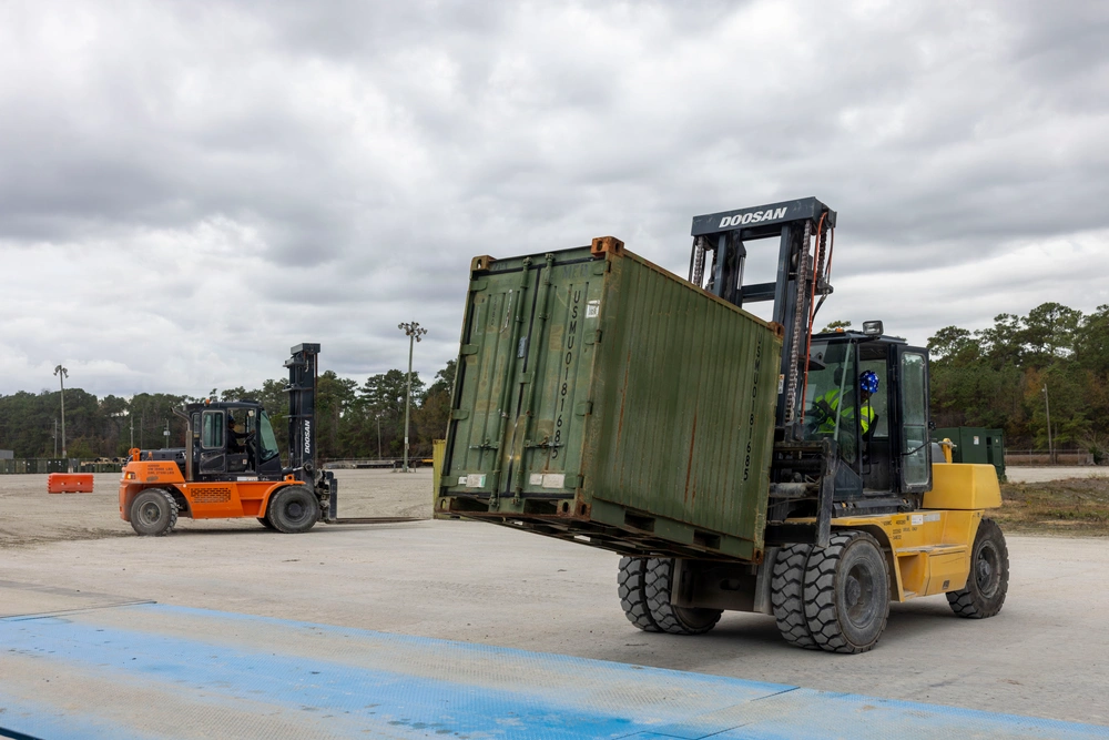 Forklift moving a container during Combat Logistics Battalion 24 training.