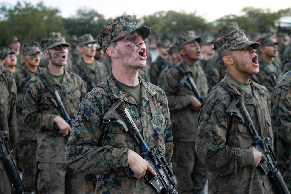 Mike Company Marines yelling during the Eagle, Globe, and Anchor Ceremony.