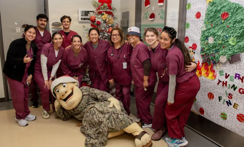 NMCSD staff with the San Diego Padres mascot during a holiday visit.