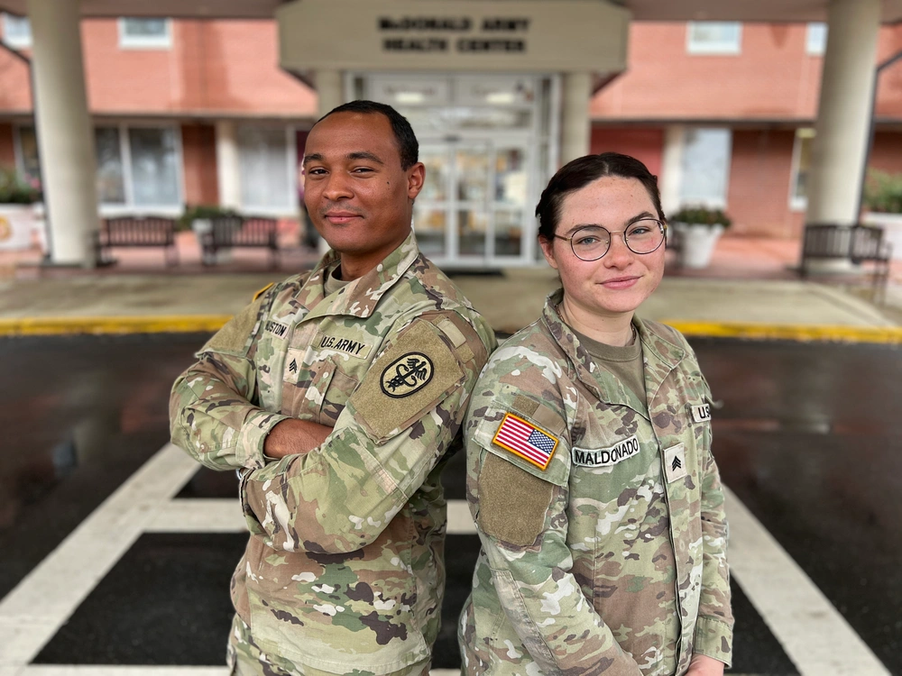 Sgts. Raven Maldonado and Jaden Huston stand in front of McDonald Army Health Center. Army Medical Department program.