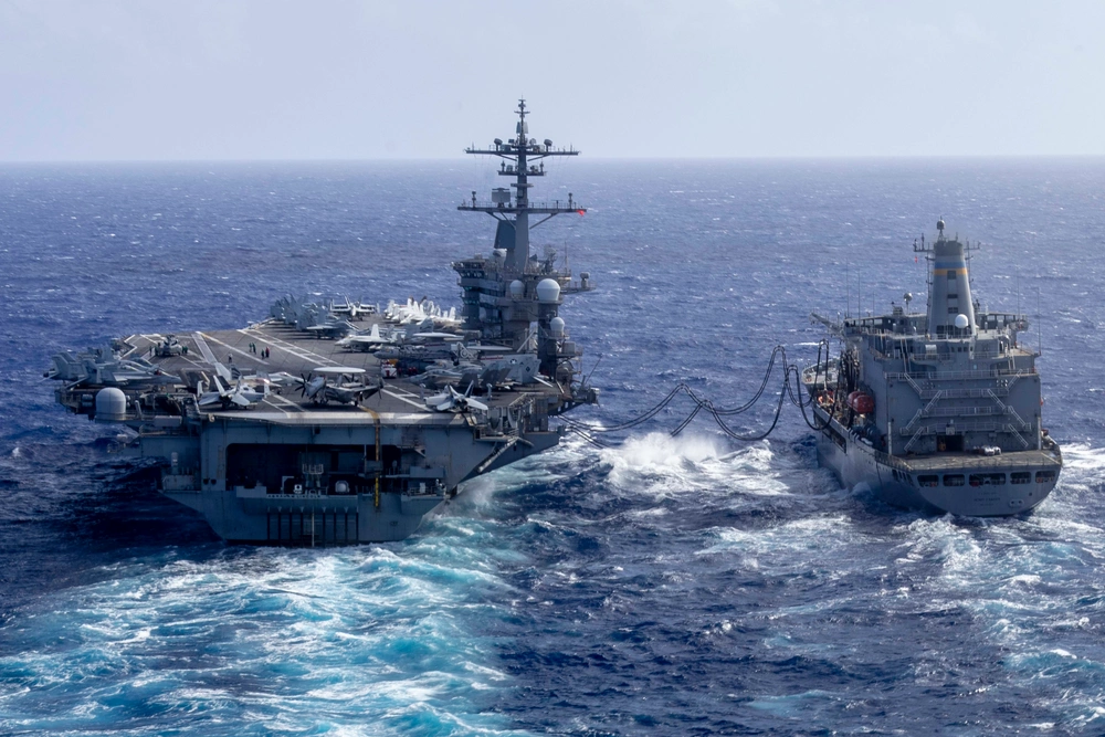 Abraham Lincoln aircraft carrier refueling from the Henry J. Kaiser replenishment oiler at sea.