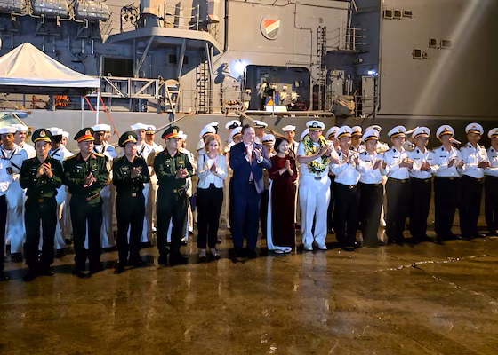 USS Tripoli and USS Robert Smalls arrive in Da Nang, Vietnam, greeted by officials.