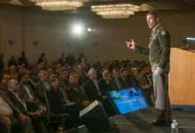 DISA official speaking at a conference about capability acquisition and delivery speed.