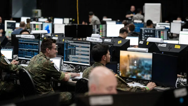 NATO team working on computers with AI-enabled Google Cloud during joint Ukraine training.