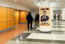 GenAI.mil poster featuring a pointing man in a suit, with soldiers walking in the background.