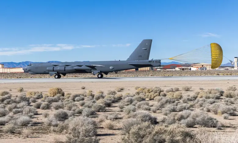 B-52 bomber deploying a parachute during landing at Edwards Air Force Base for radar upgrade testing.