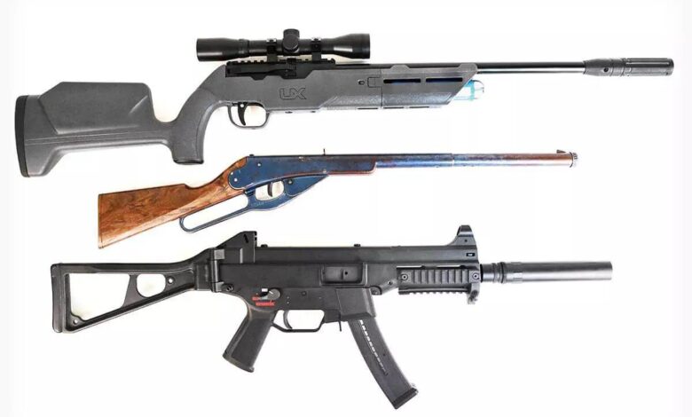 Three air rifles: Umarex .22-Caliber, Daisy, and a black rifle with folding stock.