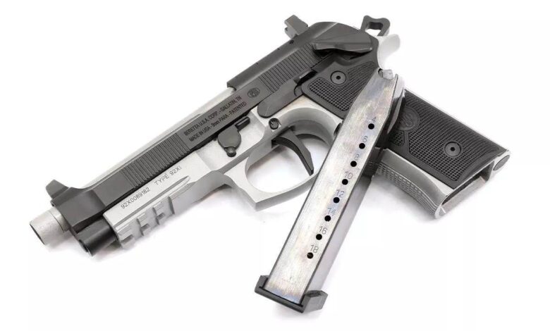 Beretta 92XI SAO tactical pistol with extended magazine. Text: "TYPE 92X1" and "MADE IN USA - 9mm PARA