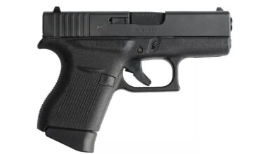 Glock 43 compact pistol, ideal for everyday carry (EDC). Close-up view on a white background.