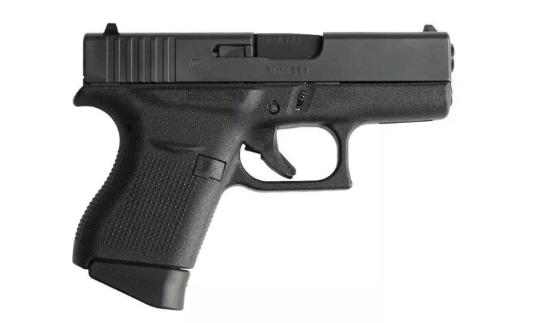 Glock 43 compact pistol, ideal for everyday carry (EDC). Close-up view on a white background.