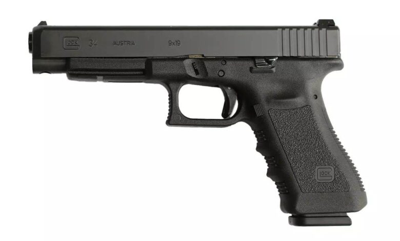 Glock 34 pistol. Text on the slide reads: Glock 34, Austria, 9x19.