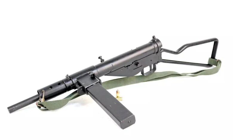 British Sten machinegun, a simplistic WWII submachine gun with a side-mounted magazine and wire stock.