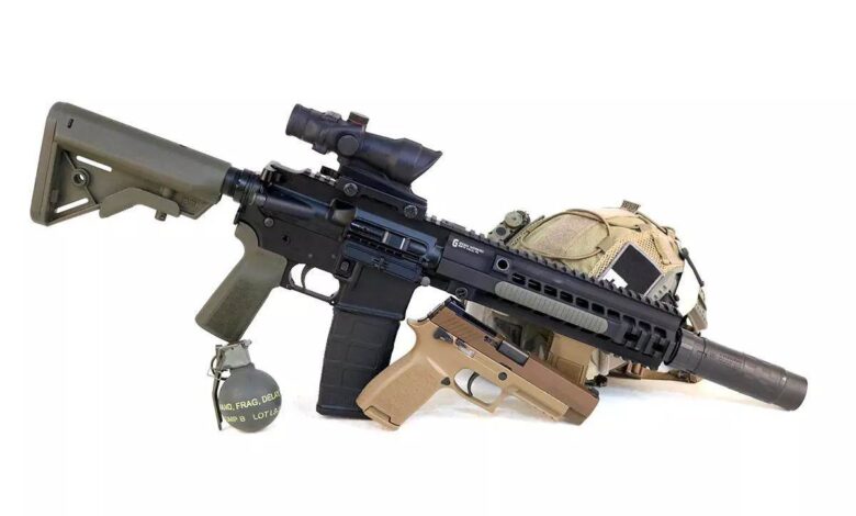 HK 416 build with Brownells BRN4 upper, pistol, grenade, and tactical helmet on a white background.