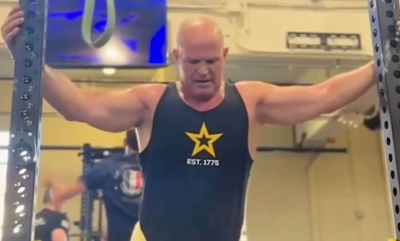 Soldier in Army PT tank top working out at the gym. Est. 1775.