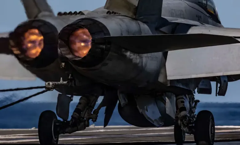 F/A-18 Super Hornet on aircraft carrier, afterburners firing. Possible relation to US military aircraft accidents.