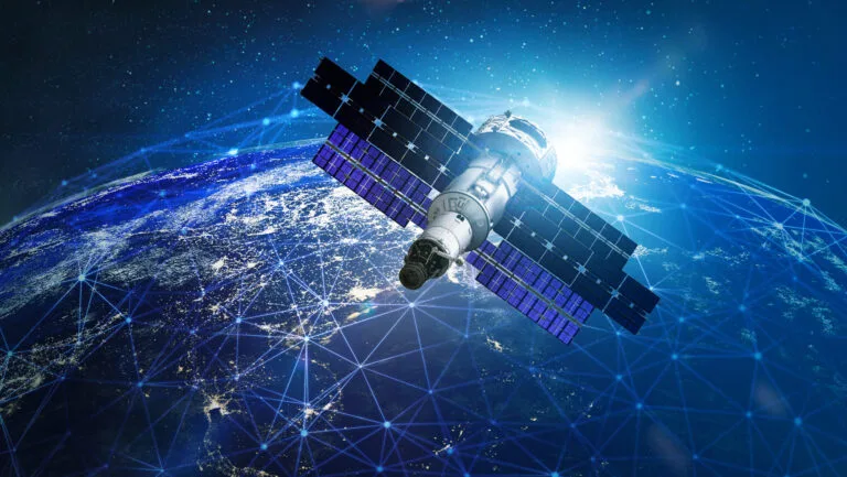 Satellite orbiting Earth, representing geospatial intelligence technology.