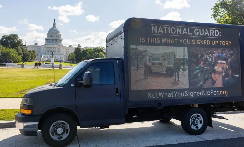 Truck with "National Guard: Is this what you signed up for?" billboard near the Capitol.
