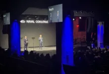 ShipOS presentation: Speakers on stage at the Navy-Palantir partnership event.