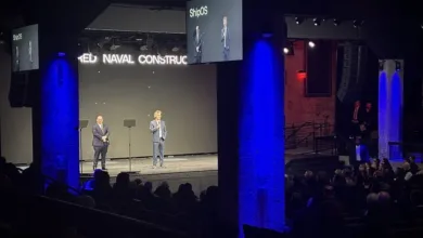 ShipOS presentation: Speakers on stage at the Navy-Palantir partnership event.