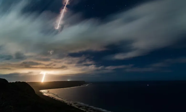 Night view of a missile launch over the ocean, related to the Iranian Forces seizing a tanker.
