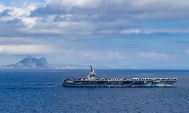 US aircraft carrier sailing in the Caribbean, likely part of buildup near Venezuela.