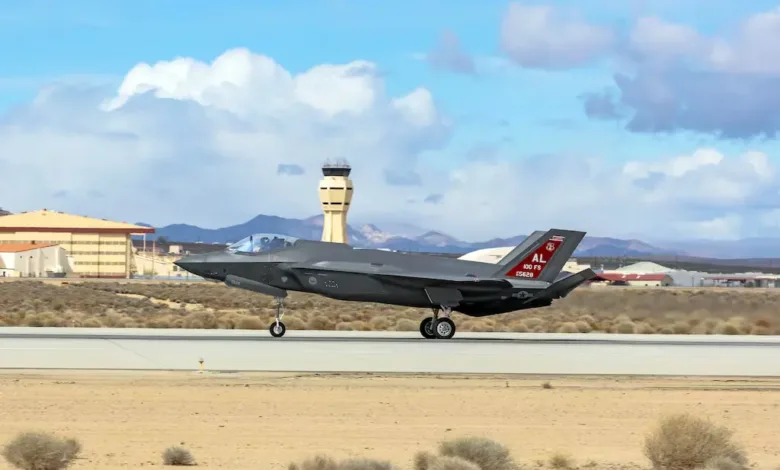 F-35A Lightning II fighter jet of the US Air Force landing on a desert runway.