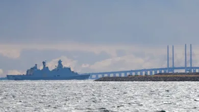 Danish frigate sailing near the Øresund Bridge. Denmark enhances coastal defense.