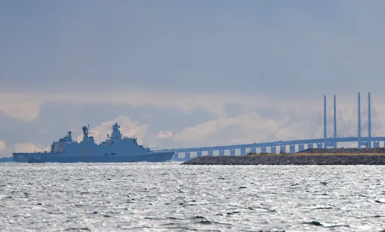 Danish frigate sailing near the Øresund Bridge. Denmark enhances coastal defense.