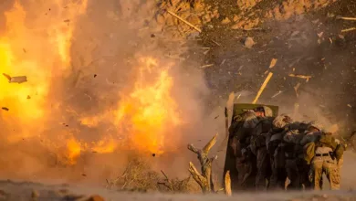 US Marines shielded from explosion during combat training exercise in Japan.