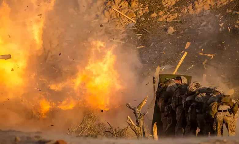 US Marines shielded from explosion during combat training exercise in Japan.