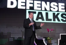 Man speaking at "Defense Talks" event, Pentagon strategy focus.