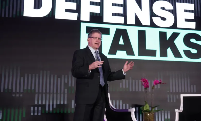 Man speaking at "Defense Talks" event, Pentagon strategy focus.