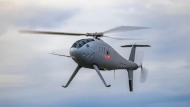 Schiebel Camcopter S-300 in flight. Unmanned helicopter drone in the sky.
