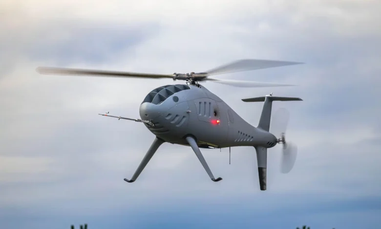 Schiebel Camcopter S-300 in flight. Unmanned helicopter drone in the sky.