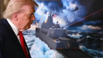 Donald Trump views a rendering of a new Navy battleship with lasers, possibly related to news of new battleships.