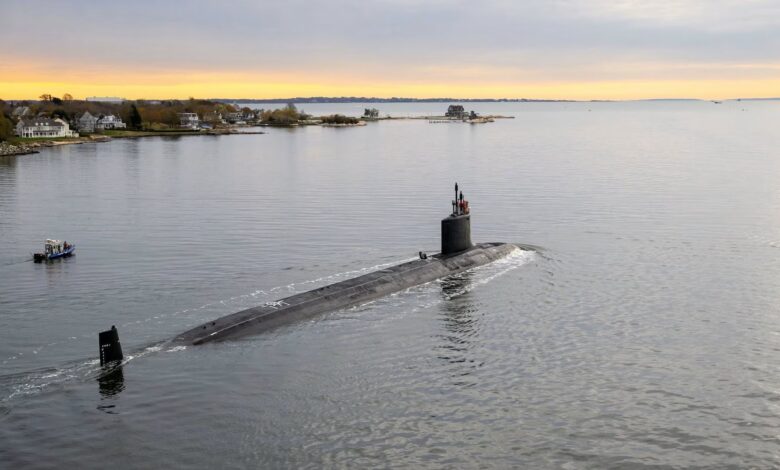 Attack sub Idaho, built by General Dynamics Electric Boat, on the water at sunrise.