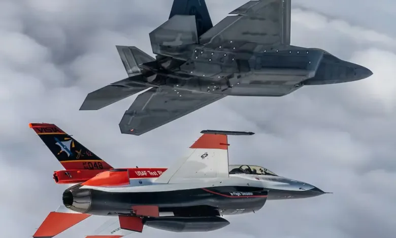 US Air Force F-22 Raptor and VISTA X-62A experimental AI fighter jet in flight.