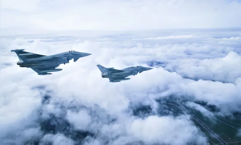 Two fighter jets, including a Eurofighter, flying above clouds. Bangladesh warplane consideration.