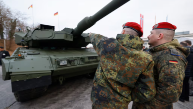 German Leopard tank with soldiers in camouflage uniforms and red berets. Croatia buys Leopard tanks.