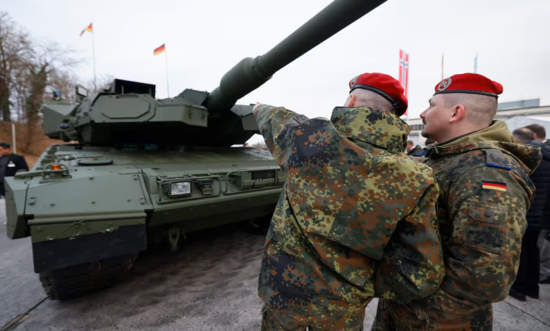 German Leopard tank with soldiers in camouflage uniforms and red berets. Croatia buys Leopard tanks.