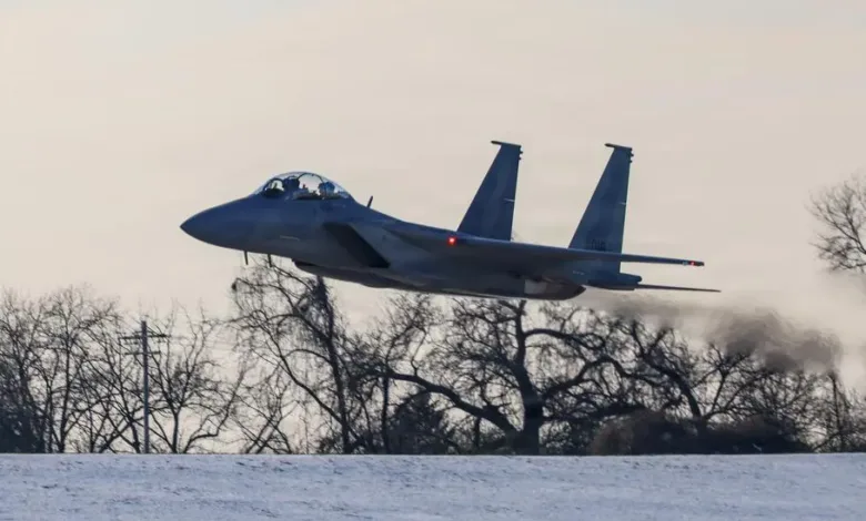F-15EX fighter jet takes off, leaving a trail of smoke.