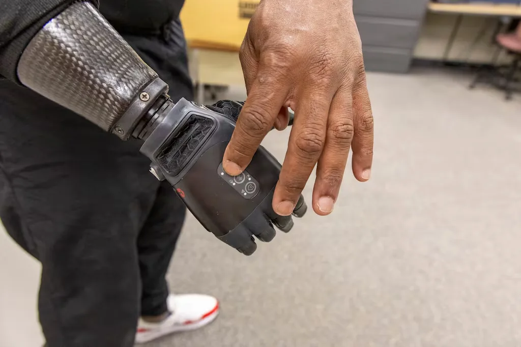 Man with neural-enabled prosthetic limb regaining sense of touch.