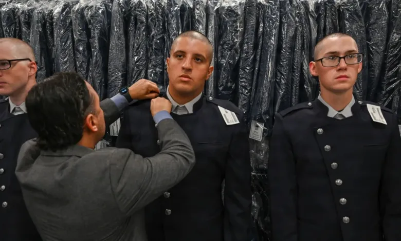 Space Force trainees getting fitted for their new dress uniform.