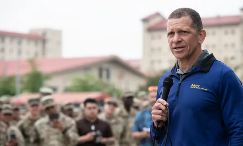 Man speaking to soldiers about Army Emergency Relief grants.