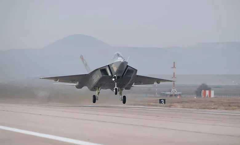 Turkish Aerospace KAAN fighter jet taking off on runway. Gray military aircraft in flight.