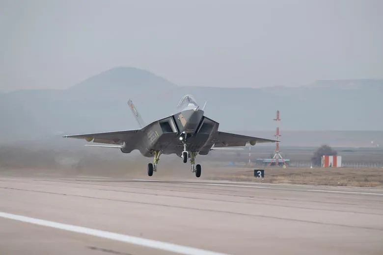 Turkish Aerospace KAAN fighter jet taking off on runway. Gray military aircraft in flight.